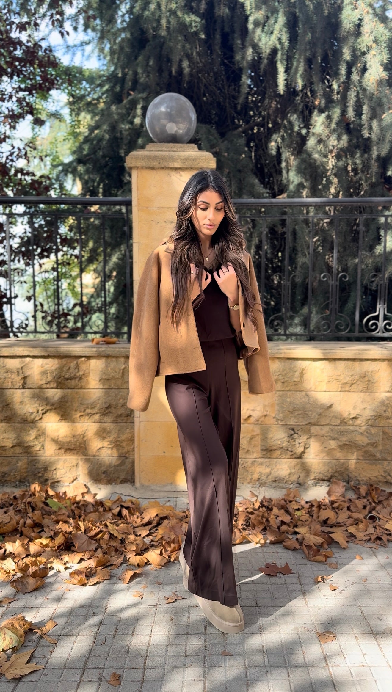 short-sleeve top and high-waisted, wide-leg trousers.