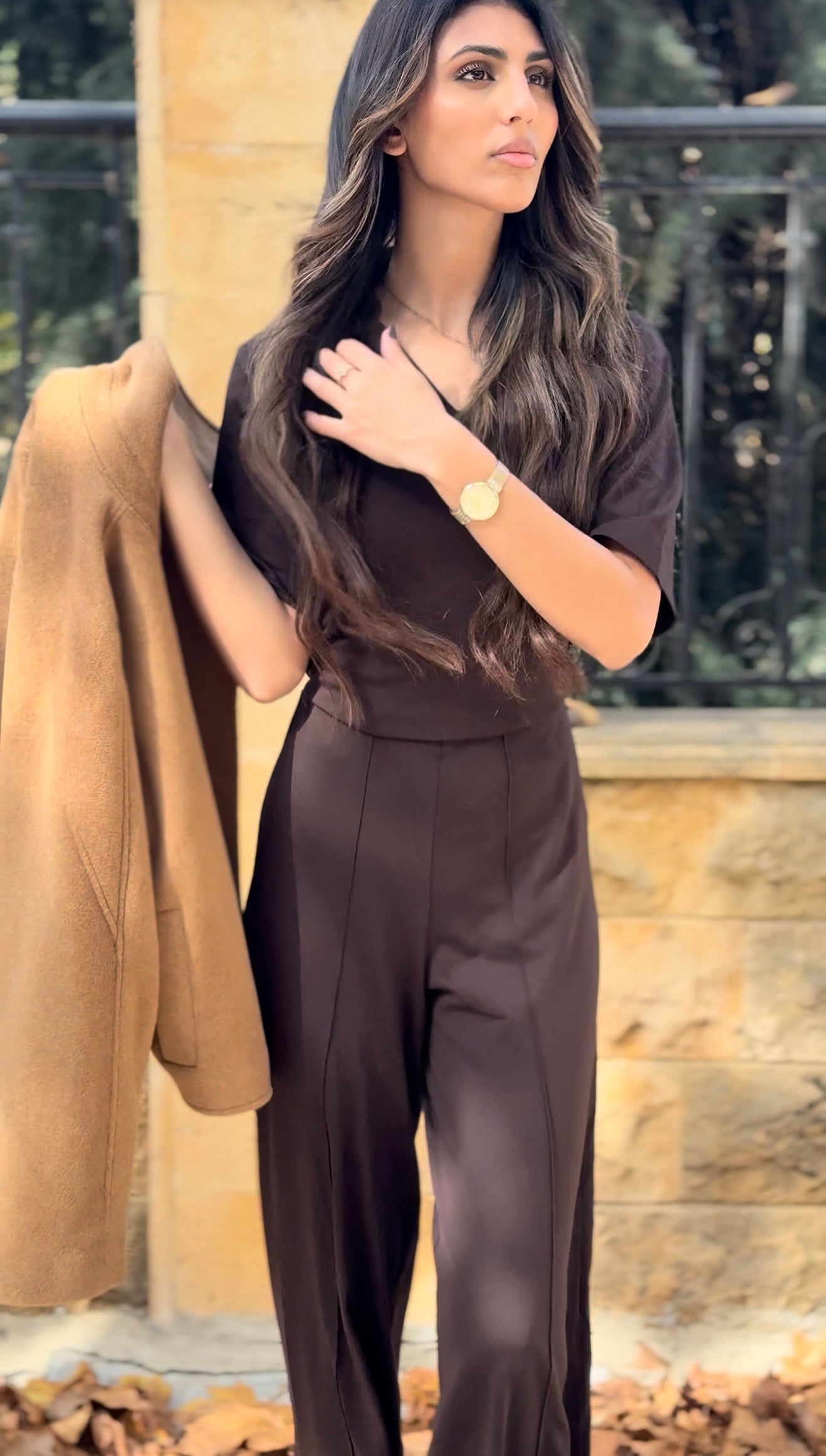 short-sleeve top and high-waisted, wide-leg trousers.