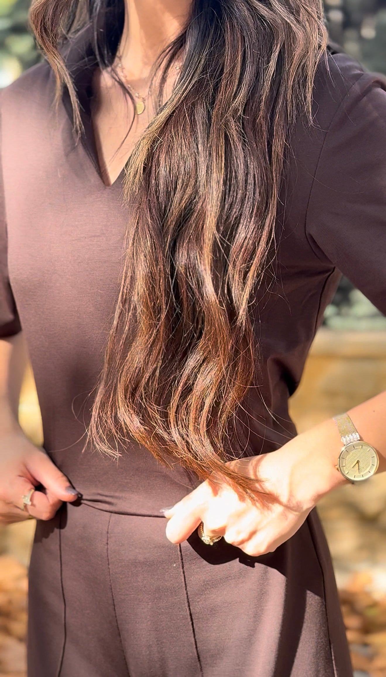 short-sleeve top and high-waisted, wide-leg trousers.