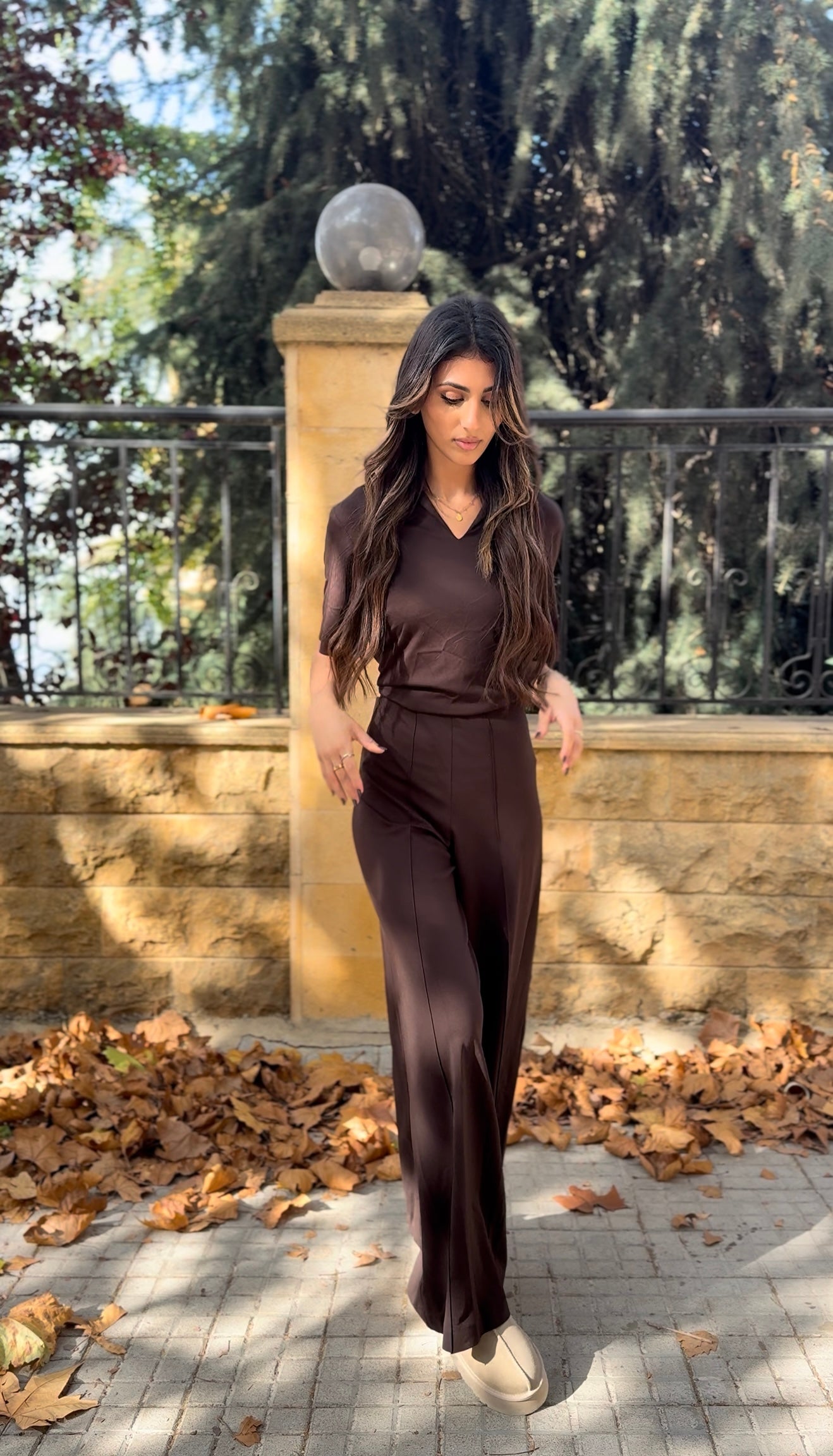 short-sleeve top and high-waisted, wide-leg trousers.